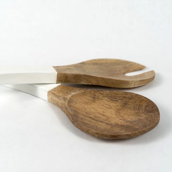 Set of serving / salad utensils made from mango wood with white enamel handles. White background.