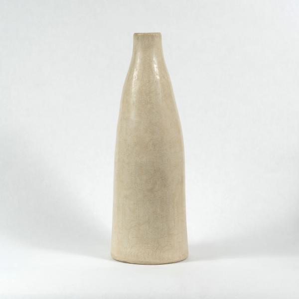 One tall slim creamy ivory Tadelakt vase. White background.