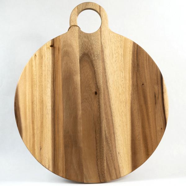 Large round board with circular handle, artisan-made from acacia wood.