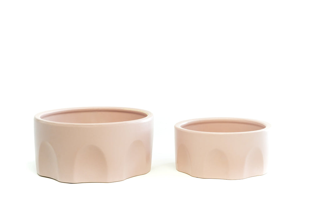 Pair of Small and Large Blush Pink Porcelain Bowls with arch design on the sides.