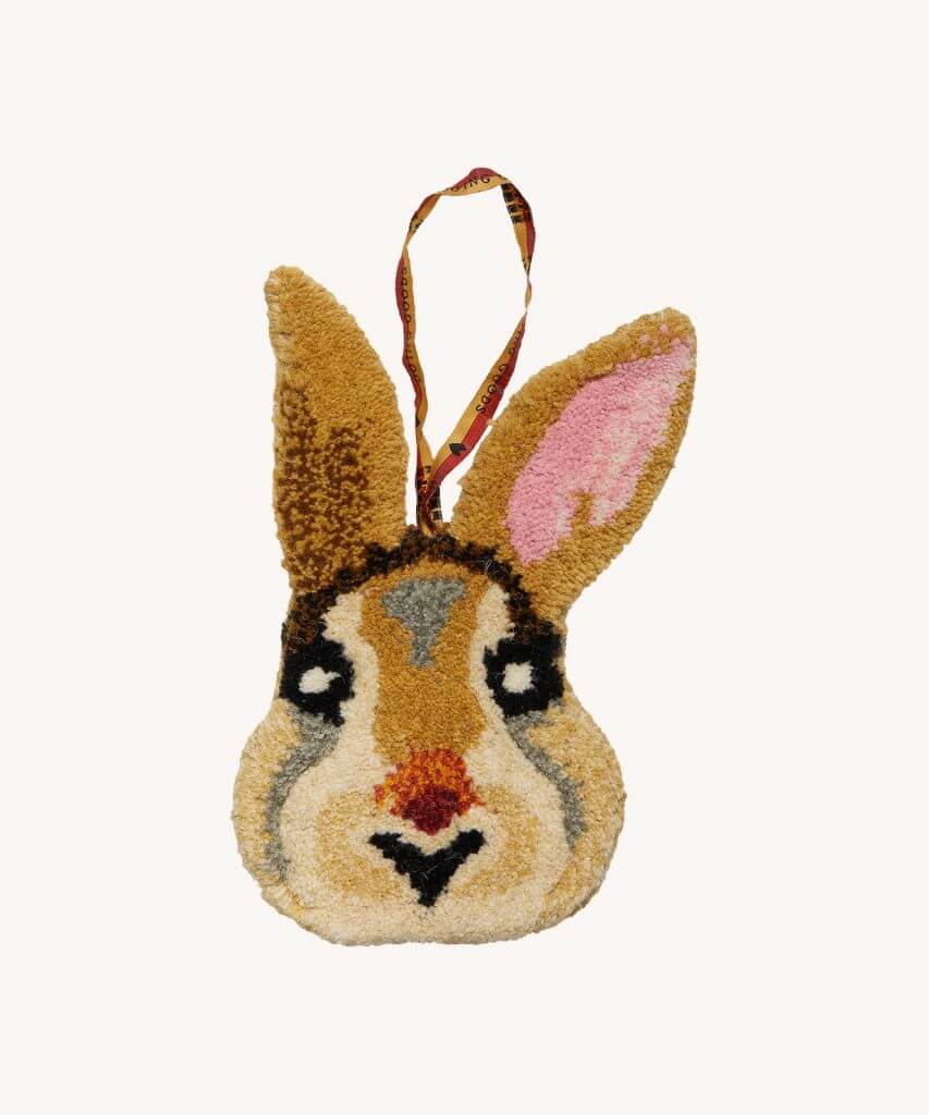 A hand tufted bunny face that can be used as a gift hanger or on a wall to add whimsy!