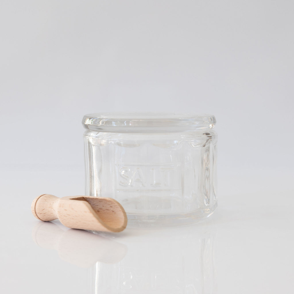 Lead free soda lime salt pot with lid. 'Salt' engraved on side. Scoop sits beside pot and is made from beechwood. 