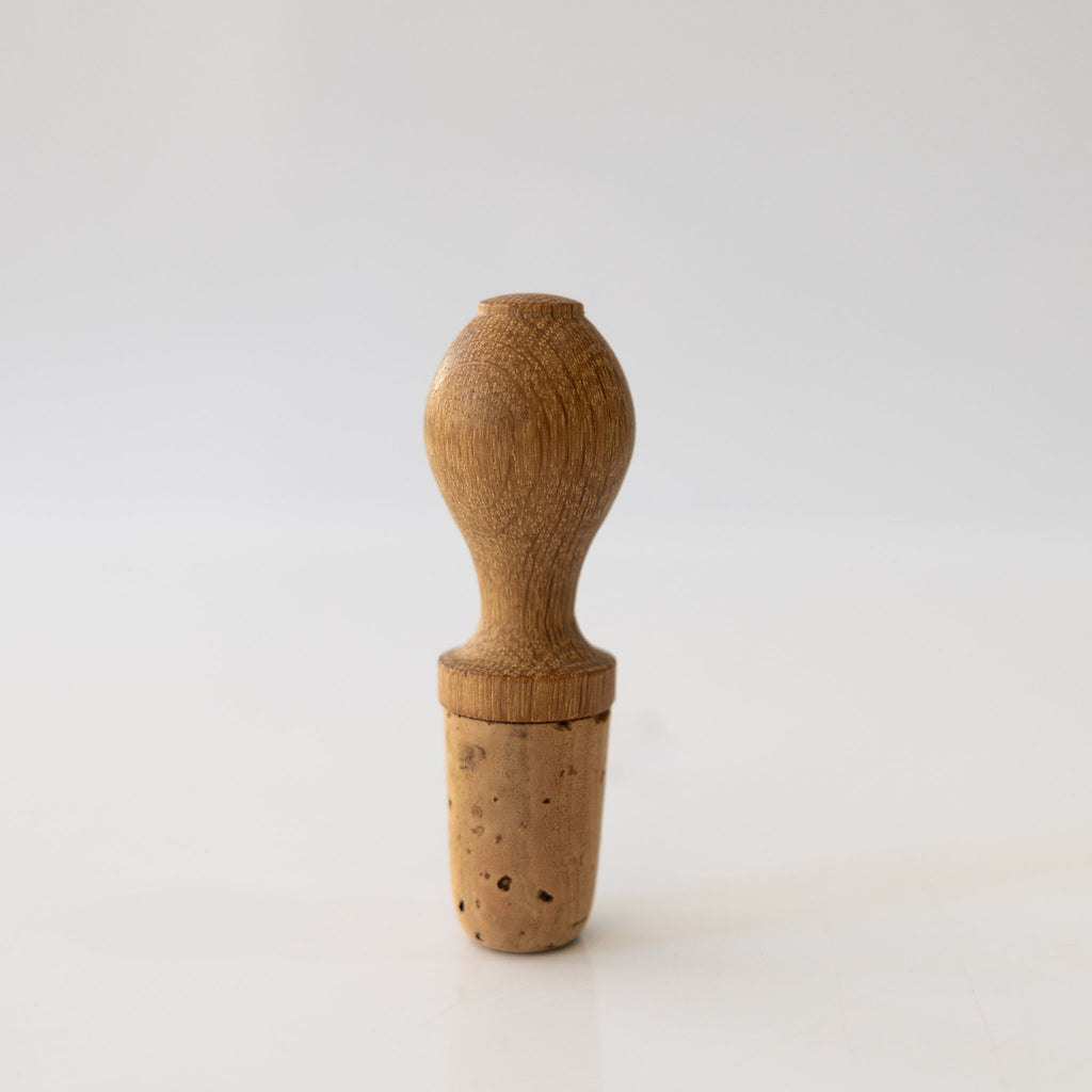 Natural cork and oak hand turned wine stopper.