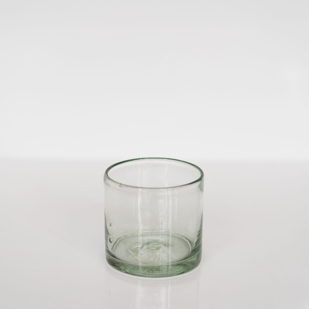Handblown old fashioned glass on a white background.