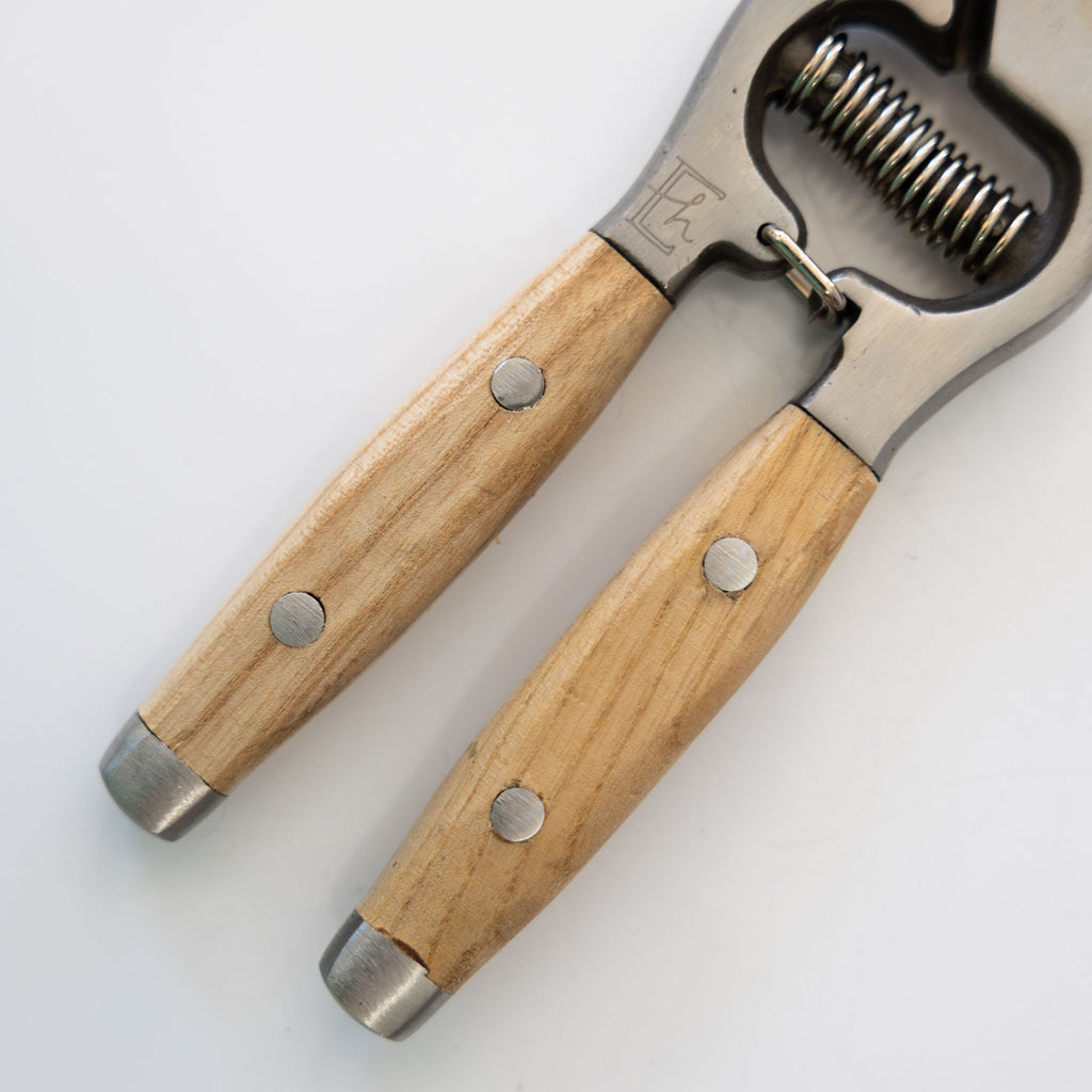 Ash handled pruning clippers with drop forged stainless blades. Close up on wood handles.
