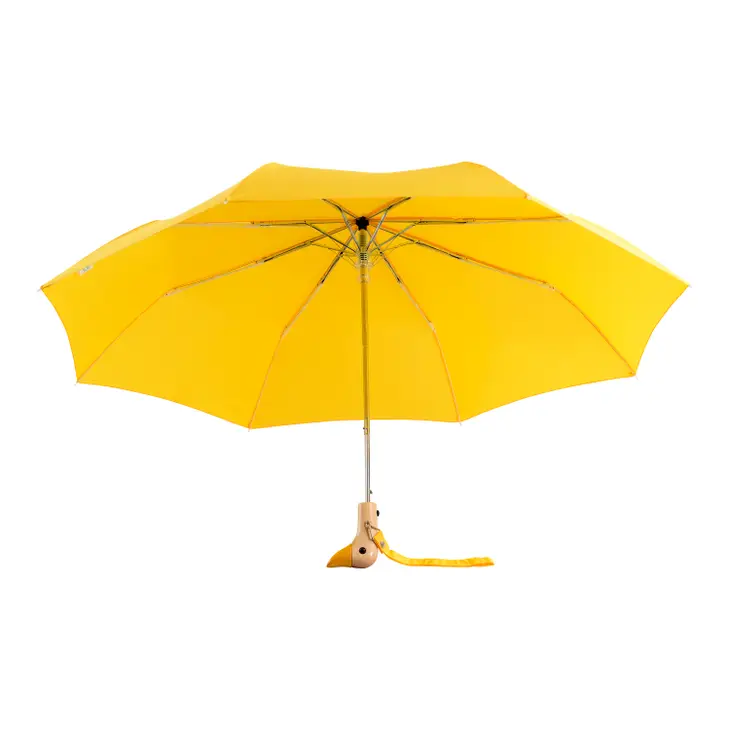 Yellow duckhead umbrella open on a white background.